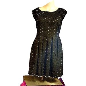 Forever 21 black dress with gold metallic dots. Side zipper. Slightly stretchy.